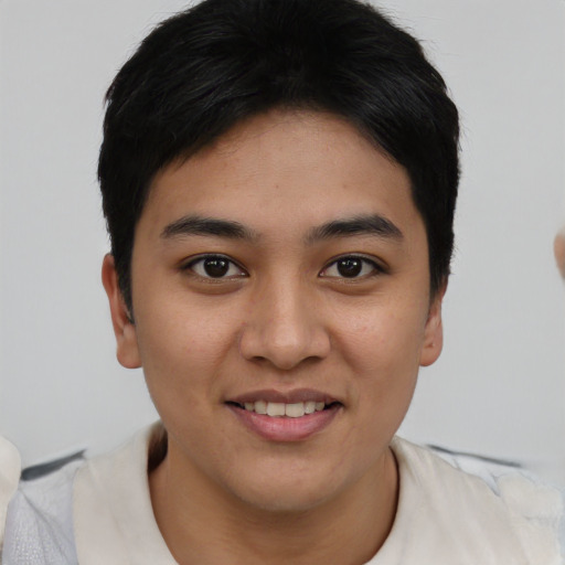 Joyful asian young-adult female with short  brown hair and brown eyes
