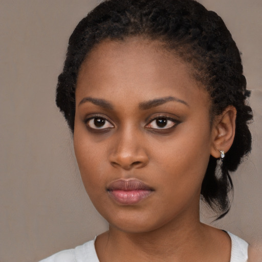 Neutral black young-adult female with long  black hair and brown eyes