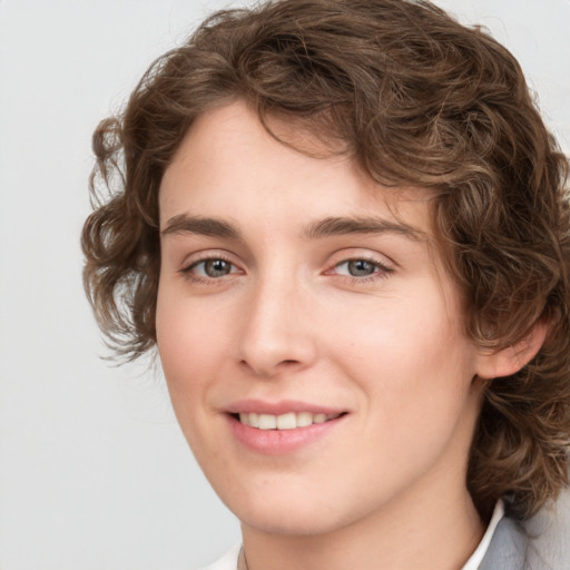 Joyful white young-adult female with medium  brown hair and green eyes