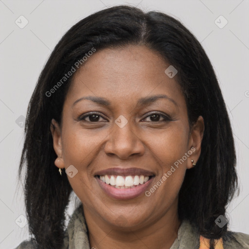 Joyful black adult female with medium  brown hair and brown eyes