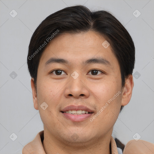 Joyful asian young-adult male with short  brown hair and brown eyes