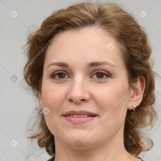 Joyful white young-adult female with medium  brown hair and green eyes