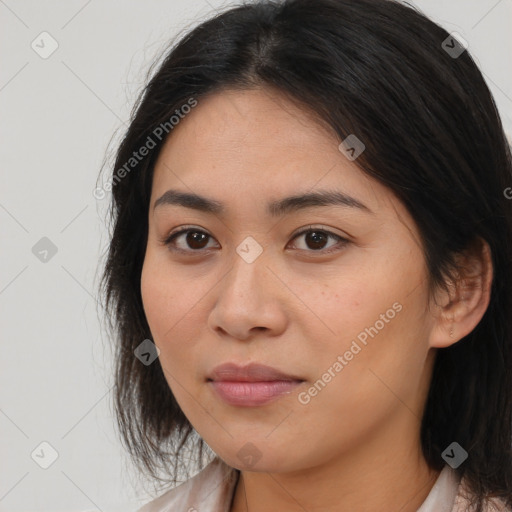 Joyful latino young-adult female with medium  brown hair and brown eyes