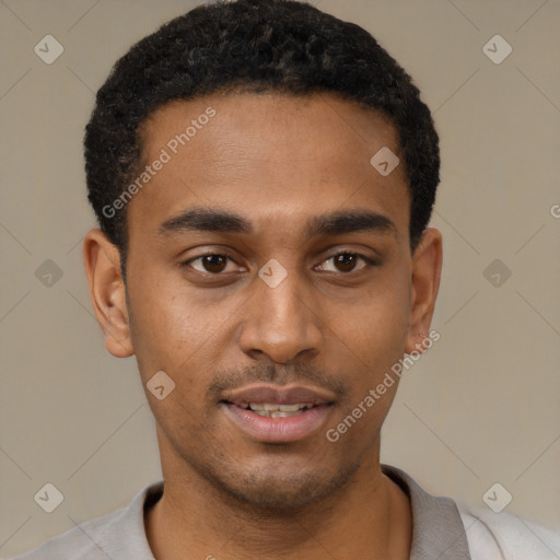 Joyful black young-adult male with short  black hair and brown eyes