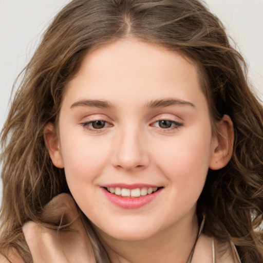 Joyful white young-adult female with long  brown hair and green eyes