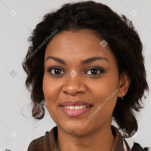 Joyful black young-adult female with long  brown hair and brown eyes