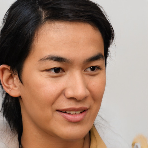 Joyful asian young-adult male with medium  brown hair and brown eyes