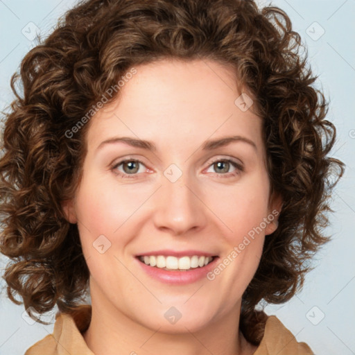 Joyful white young-adult female with medium  brown hair and green eyes