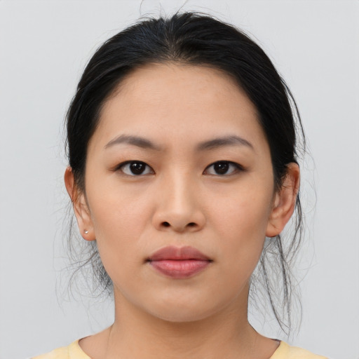 Neutral asian young-adult female with medium  black hair and brown eyes