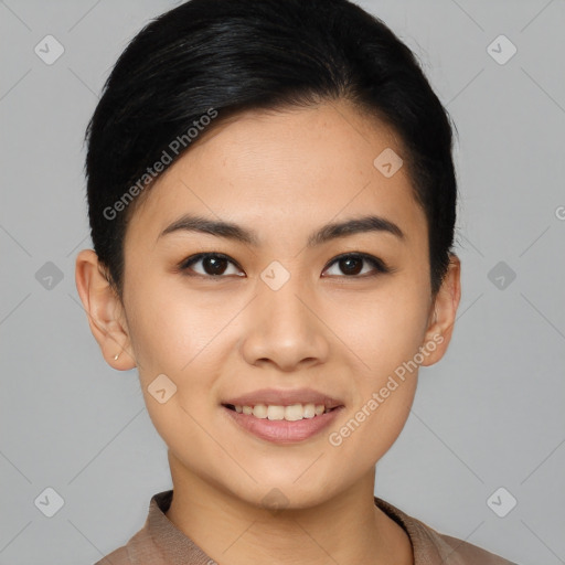 Joyful asian young-adult female with short  black hair and brown eyes