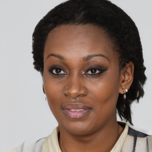 Joyful black young-adult female with medium  black hair and brown eyes