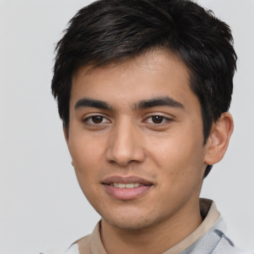 Joyful asian young-adult male with short  black hair and brown eyes