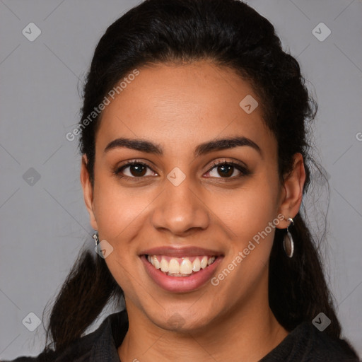 Joyful latino young-adult female with long  black hair and brown eyes