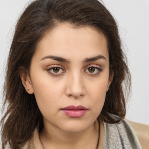 Neutral white young-adult female with long  brown hair and brown eyes