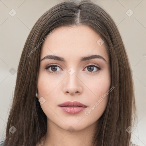 Neutral white young-adult female with long  brown hair and brown eyes