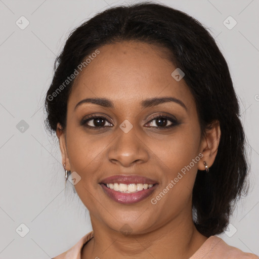 Joyful black young-adult female with medium  brown hair and brown eyes