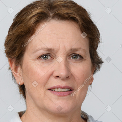 Joyful white adult female with medium  brown hair and grey eyes