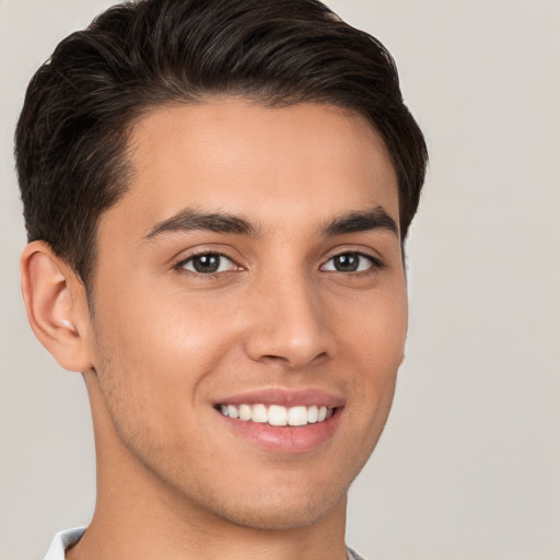 Joyful white young-adult male with short  brown hair and brown eyes