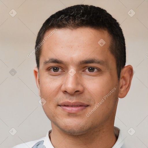 Joyful white young-adult male with short  black hair and brown eyes