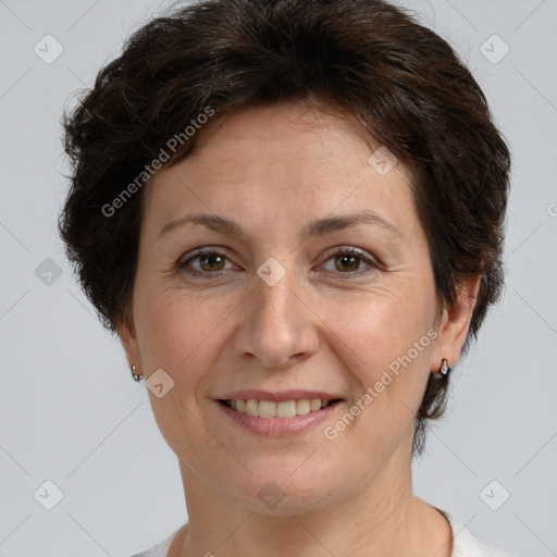 Joyful white adult female with short  brown hair and brown eyes