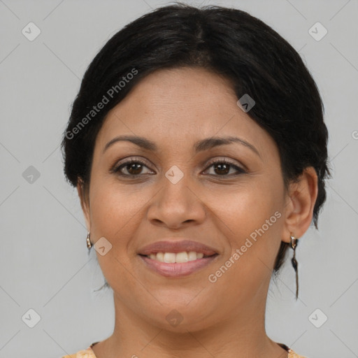 Joyful latino young-adult female with medium  brown hair and brown eyes