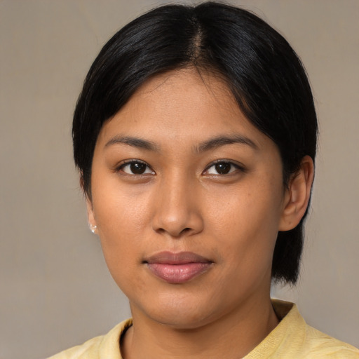 Neutral asian young-adult female with medium  brown hair and brown eyes