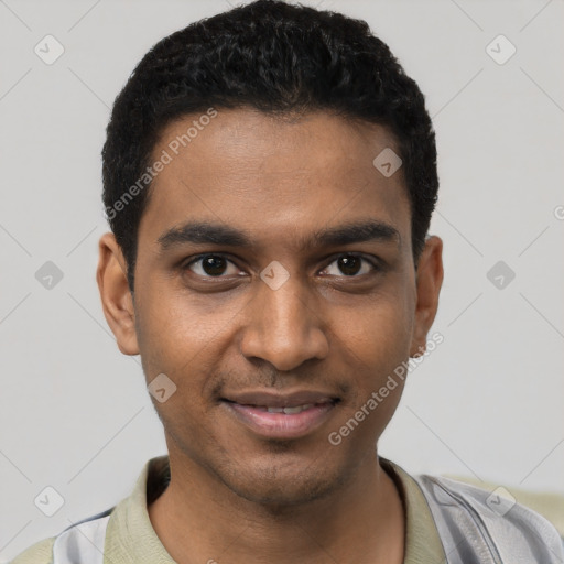 Joyful black young-adult male with short  black hair and brown eyes