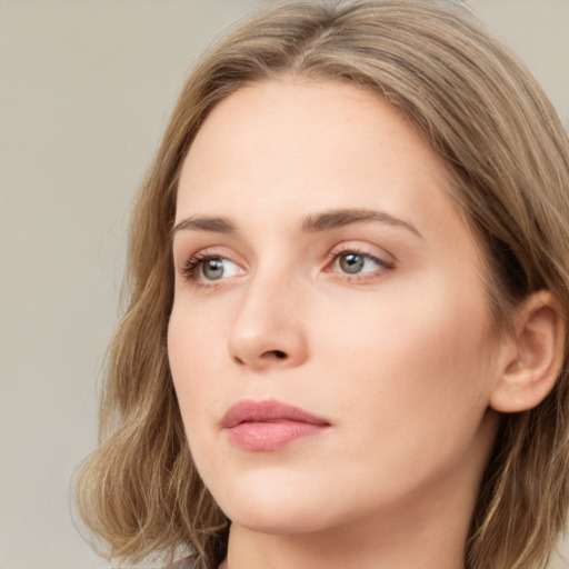 Neutral white young-adult female with medium  brown hair and green eyes