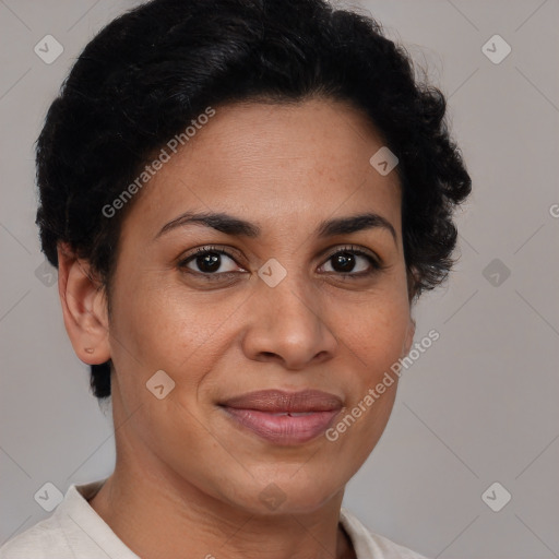 Joyful black adult female with short  brown hair and brown eyes