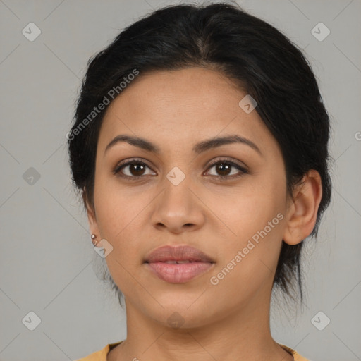 Joyful latino young-adult female with medium  brown hair and brown eyes