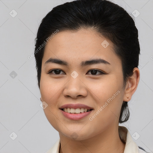 Joyful asian young-adult female with medium  brown hair and brown eyes