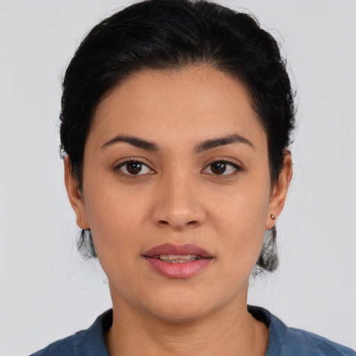 Joyful asian young-adult female with short  black hair and brown eyes