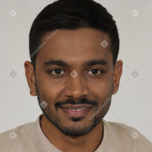 Joyful black young-adult male with short  black hair and brown eyes