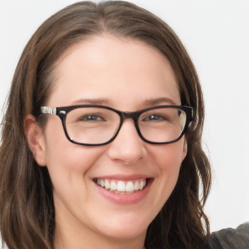 Joyful white young-adult female with long  brown hair and grey eyes