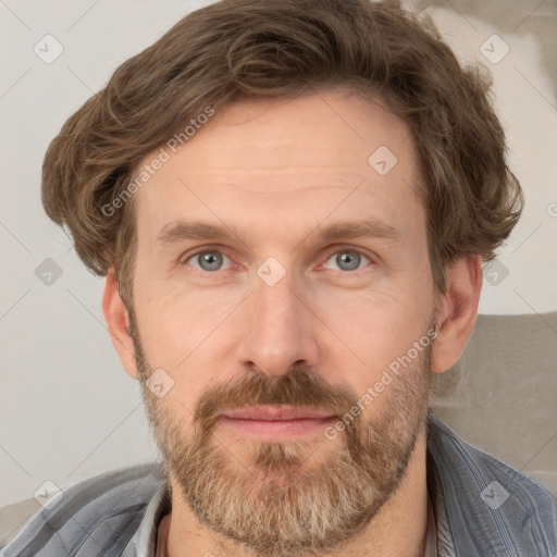 Joyful white adult male with short  brown hair and grey eyes