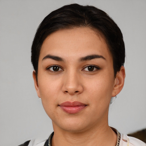 Neutral white young-adult female with short  black hair and brown eyes