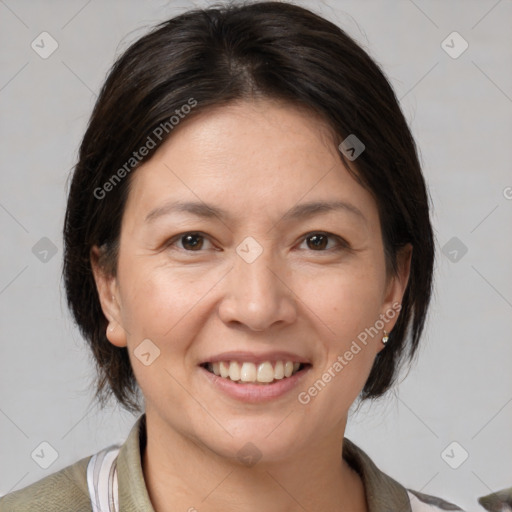 Joyful white adult female with medium  brown hair and brown eyes