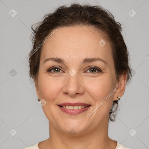 Joyful white adult female with short  brown hair and brown eyes