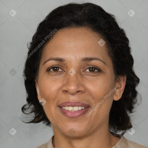 Joyful black adult female with medium  brown hair and brown eyes