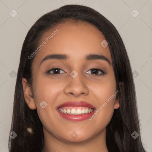 Joyful latino young-adult female with long  black hair and brown eyes