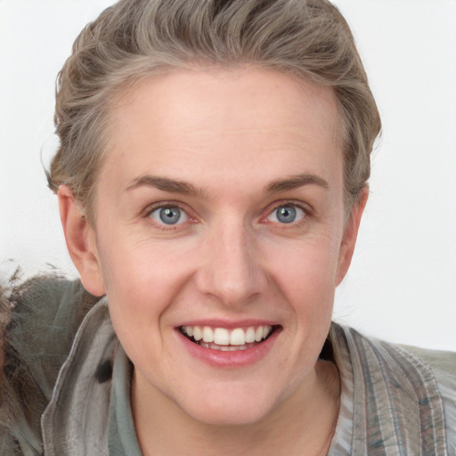 Joyful white young-adult female with short  brown hair and grey eyes