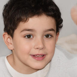 Joyful white child male with short  brown hair and brown eyes