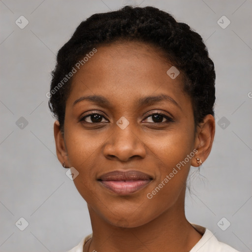 Joyful black young-adult female with short  black hair and brown eyes