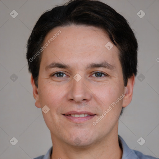 Joyful white adult male with short  brown hair and brown eyes