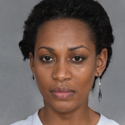 Neutral black adult female with short  black hair and brown eyes
