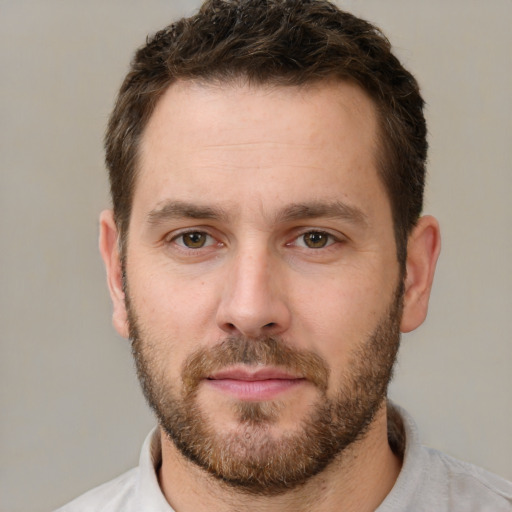 Joyful white young-adult male with short  brown hair and brown eyes