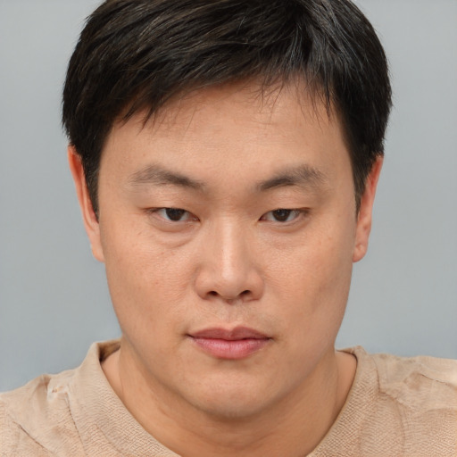 Neutral asian young-adult male with short  brown hair and brown eyes