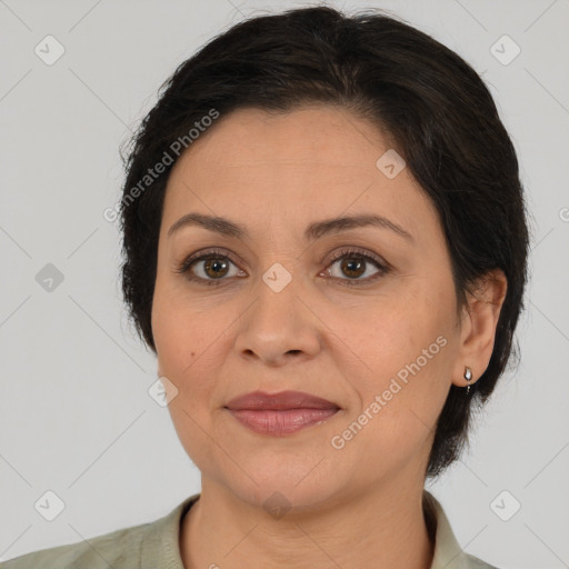 Joyful white adult female with medium  brown hair and brown eyes