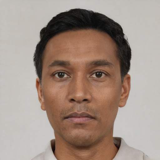 Neutral black young-adult male with short  black hair and brown eyes