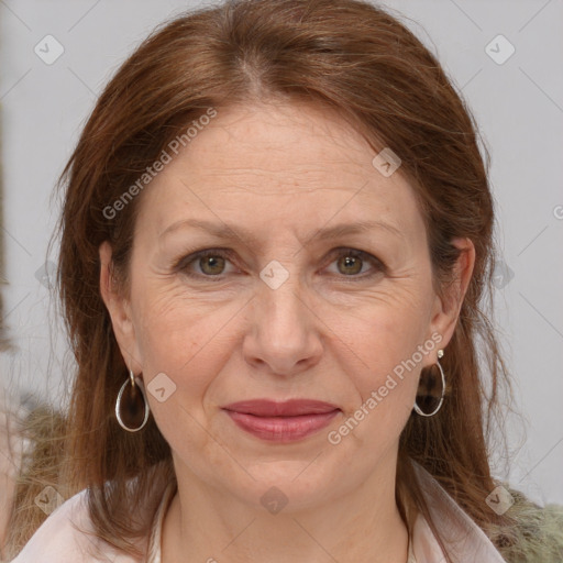 Joyful white adult female with medium  brown hair and grey eyes